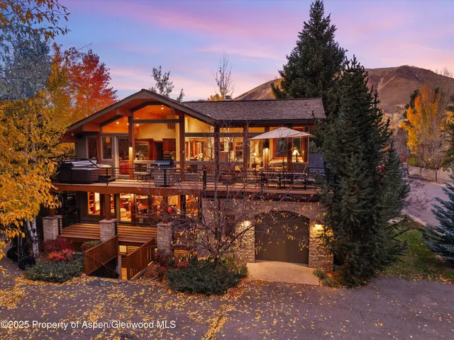 a outdoor living space with patio furniture and a fireplace
