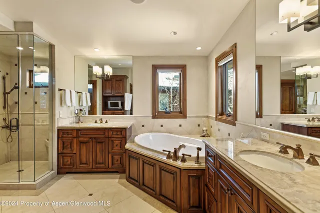 a bedroom with furniture and a flat screen tv
