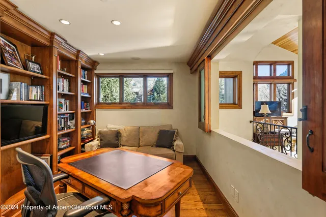 a front view of a house with a yard and tree s