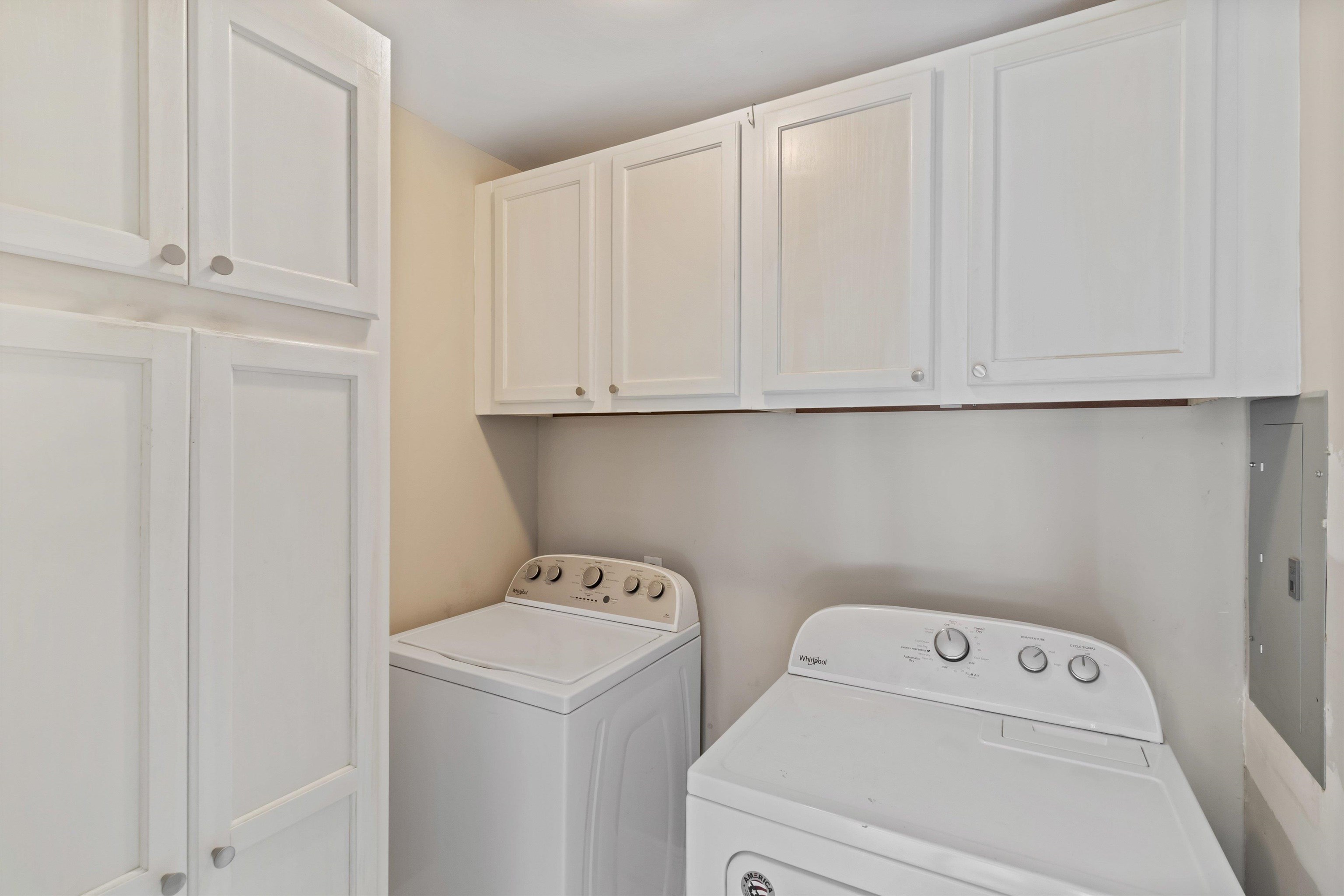 517 Malboro Road Memphis, TN 38120 - Photo 12 of 25 Laundry room with washing machine and dryer, electric panel, and cabinet space