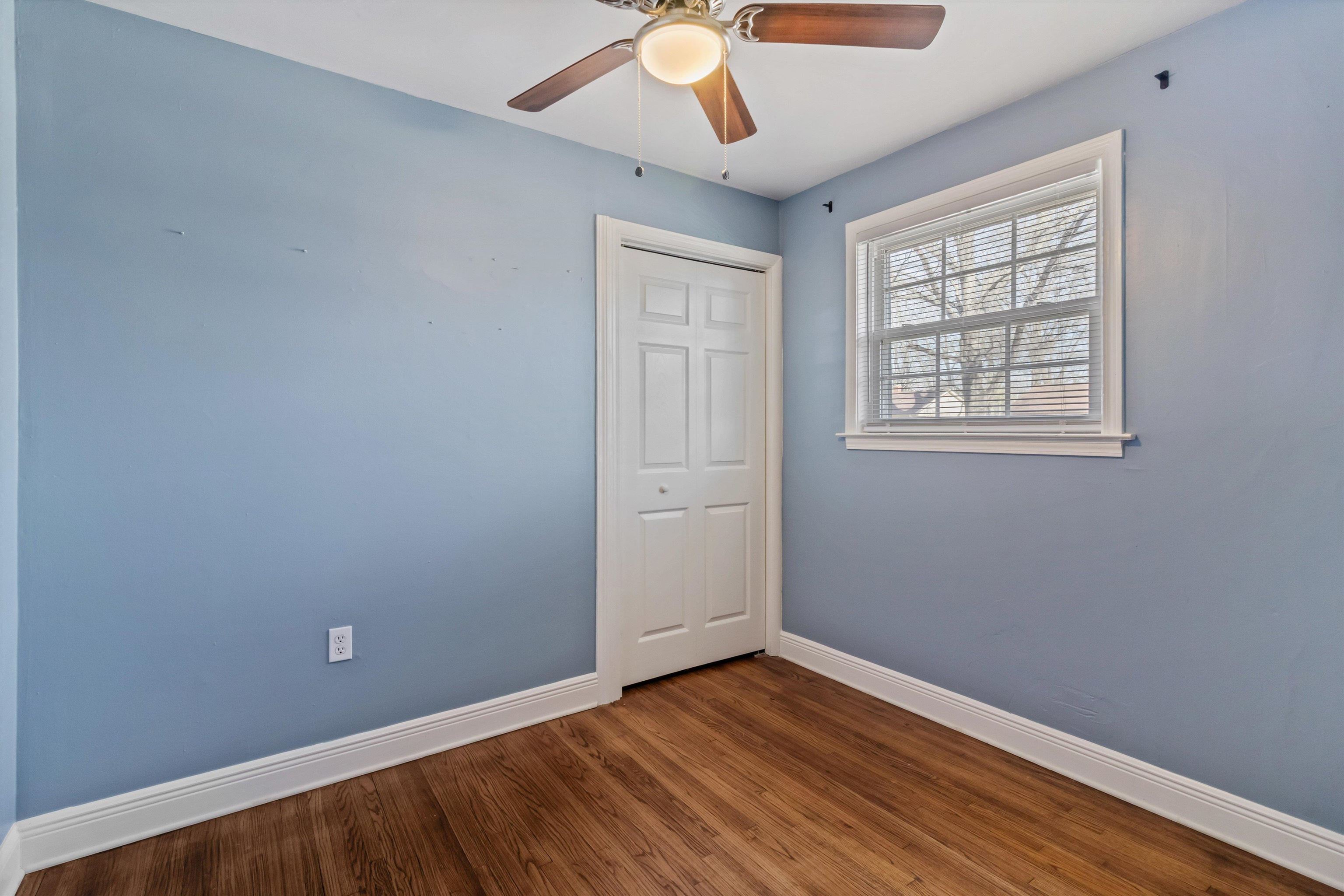 517 Malboro Road Memphis, TN 38120 - Photo 13 of 25 Unfurnished room with ceiling fan and dark wood-style floors