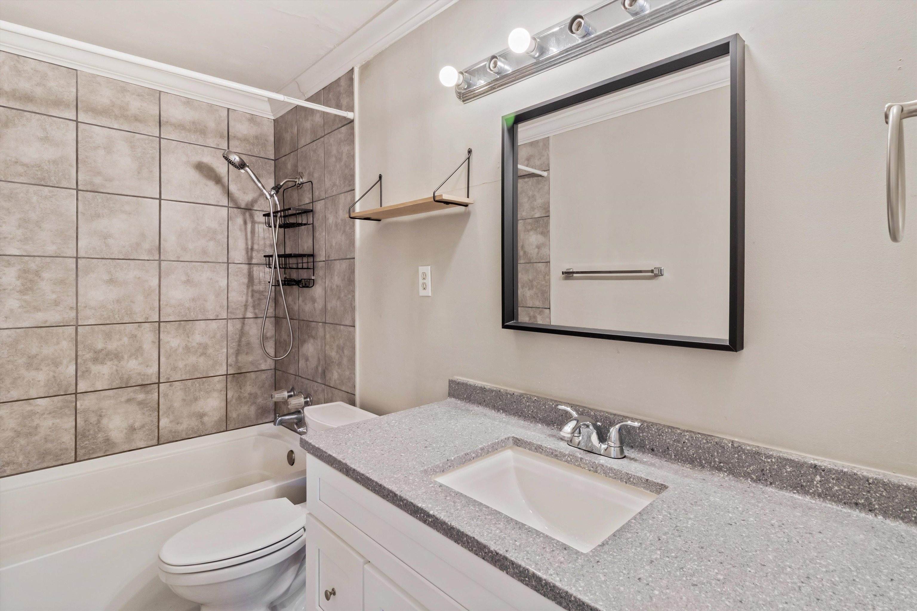 517 Malboro Road Memphis, TN 38120 - Photo 15 of 25 Full bath featuring vanity, washtub / shower combination, and crown molding