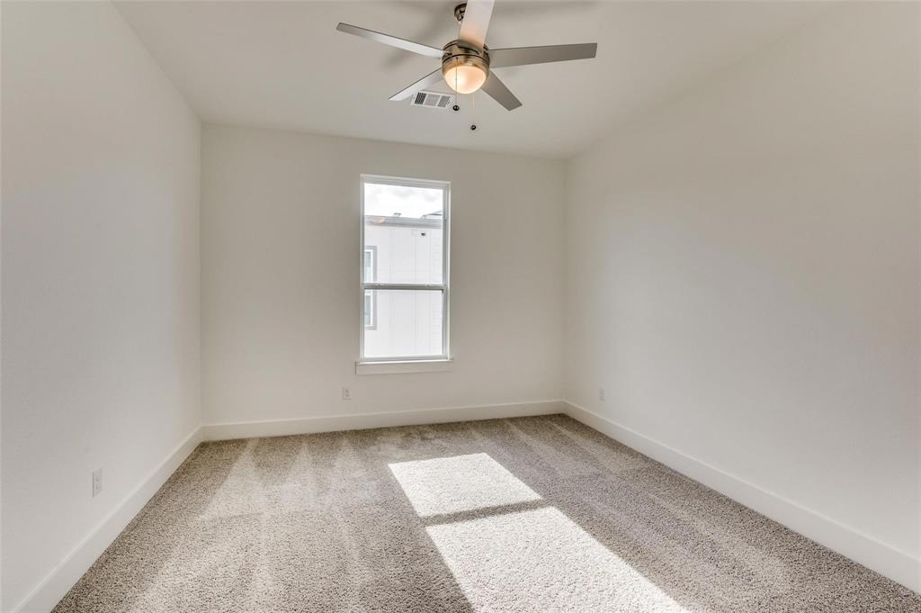 7307 Rubio Place Dallas, TX 75235 - Photo 14 of 17 an empty room with a window