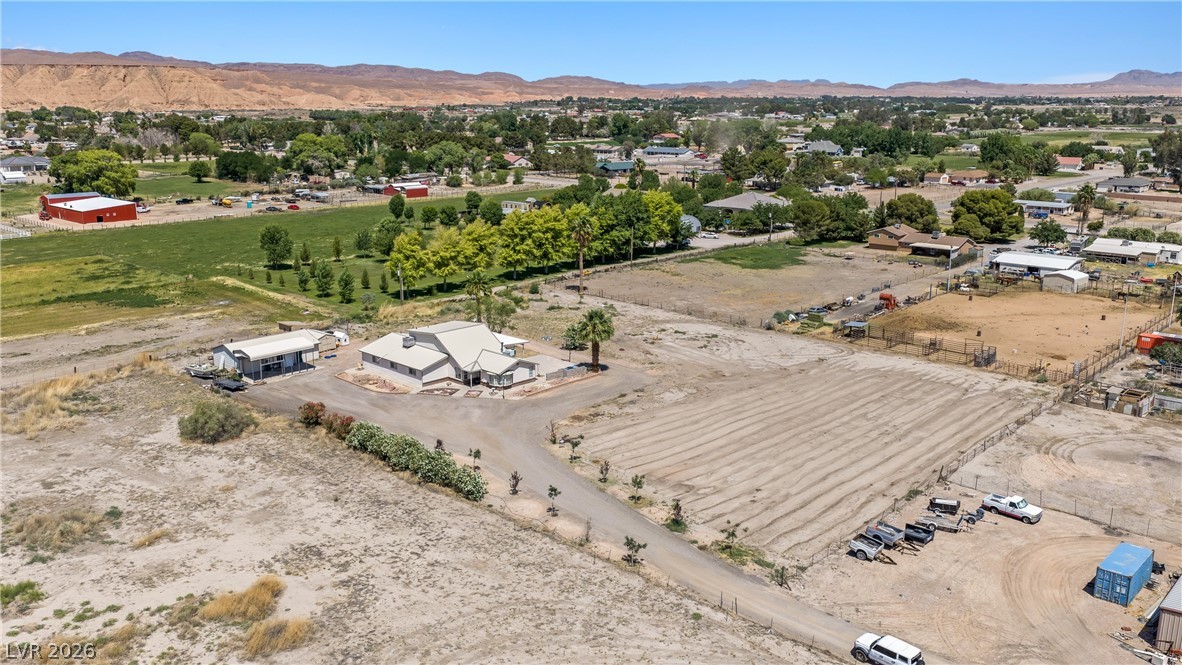 750 Leming Avenue Overton, NV 89040 - Photo 82 of 82 An aerial view showcases a residential property nestled within a vast, open landscape.