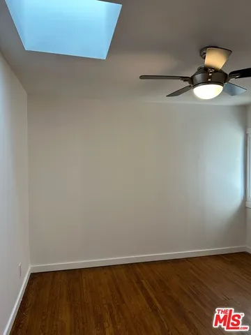 a view of room with wooden floor