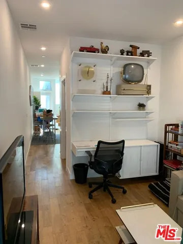 a view of workspace with cabinets