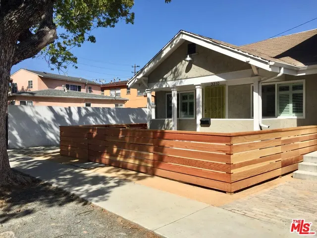 a view of sitting area in front of house