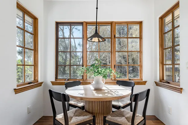 a living room with furniture wooden floor and a fireplace