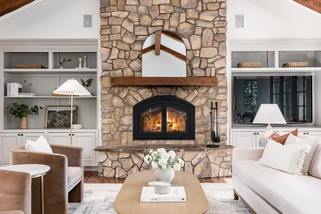 a living room with a couch and a large window