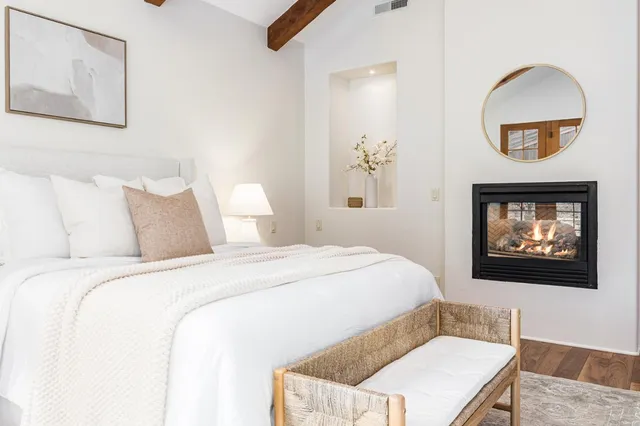 a large kitchen with a sink and a large window