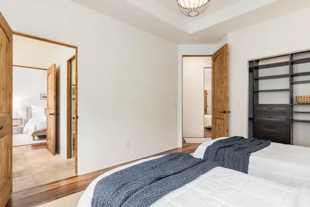a en suite bathroom with a granite countertop sink and a mirror