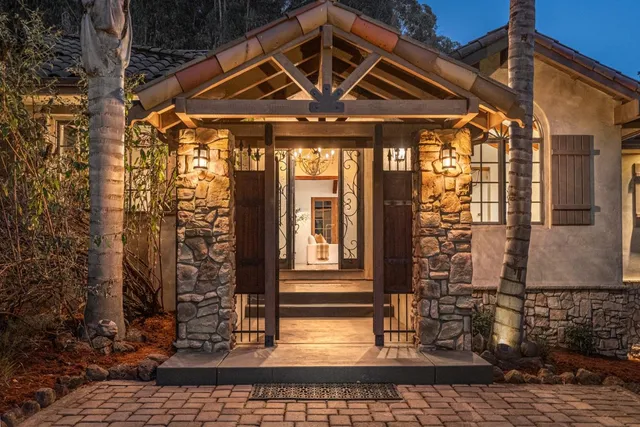 a view of entryway with wooden floor and windows