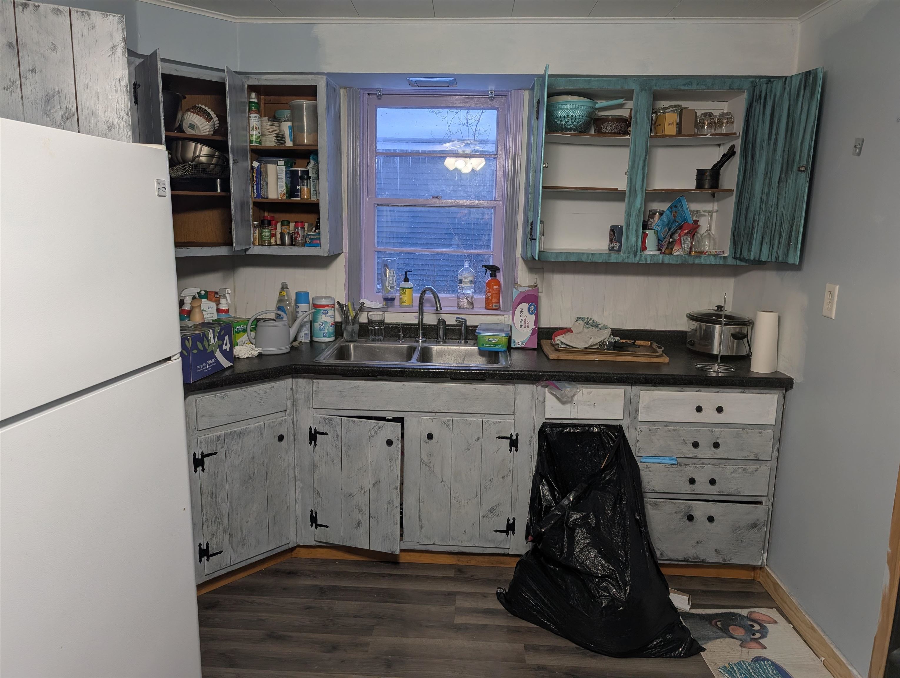 922 MacArthur Avenue Ashland, WI 54806 - Photo 3 of 20 Bar with freestanding refrigerator, dark countertops, dark wood-style floors, and open shelves