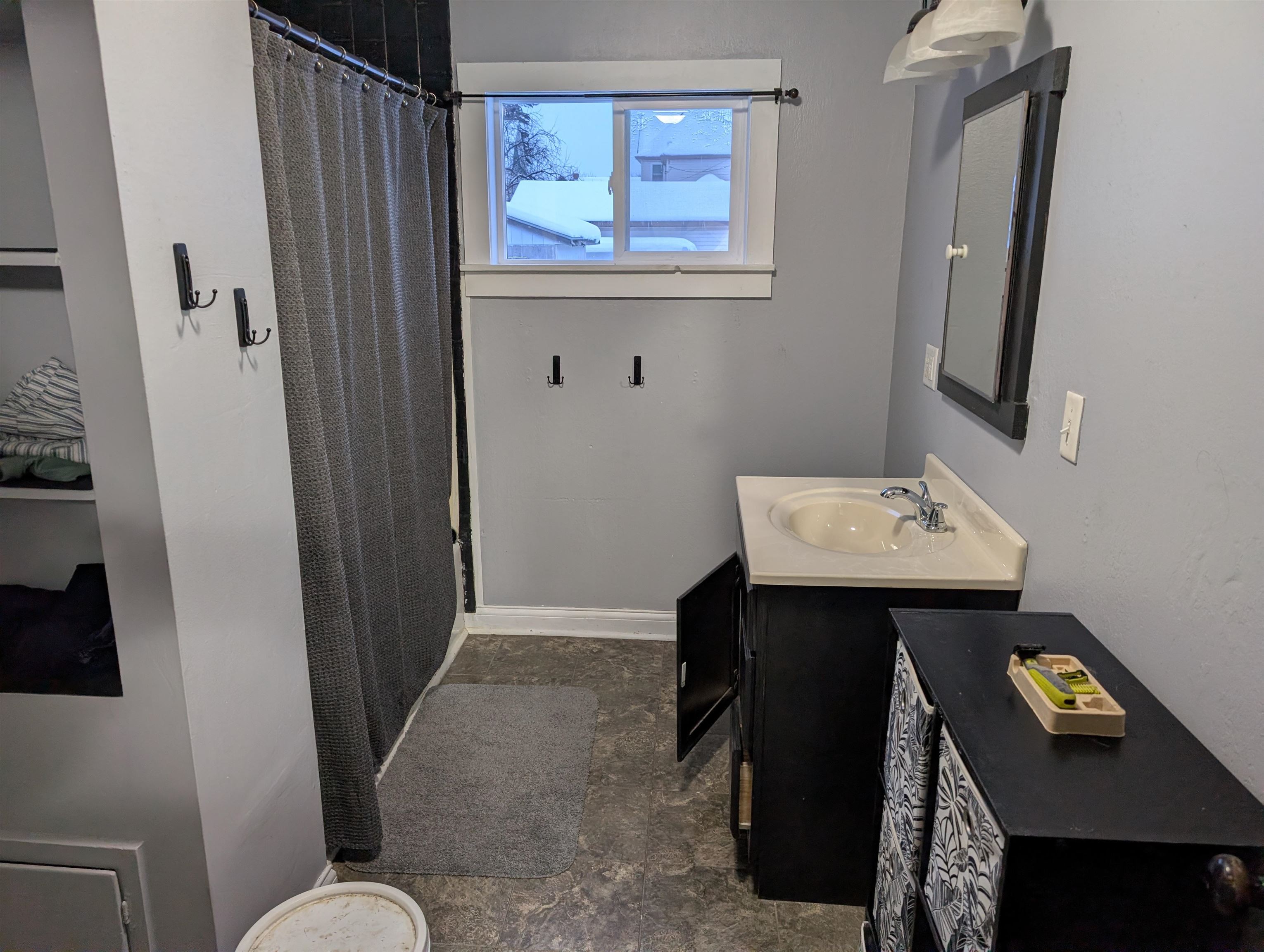 922 MacArthur Avenue Ashland, WI 54806 - Photo 8 of 20 Bathroom featuring vanity and curtained shower