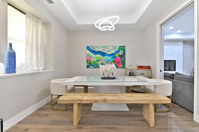 a spacious bedroom with a bed and ceiling fan