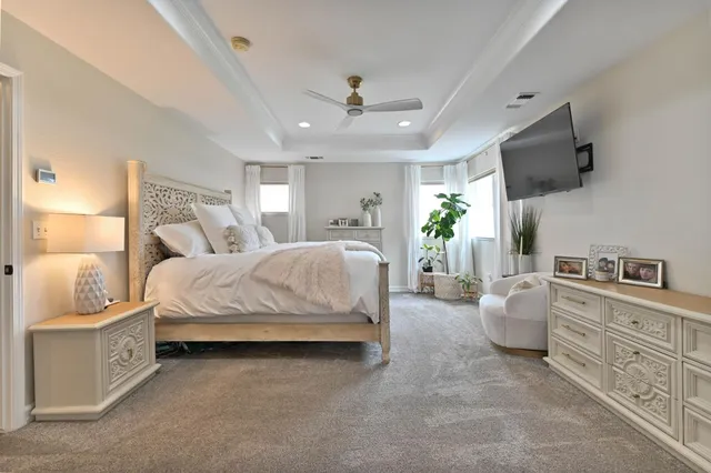 a view of a patio with table and chairs and potted plants
