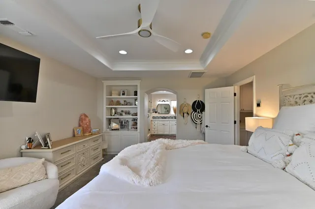 a living room with lots of furniture and a flat screen tv