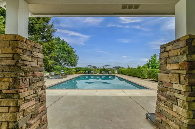 a view of a big yard with a building in the background