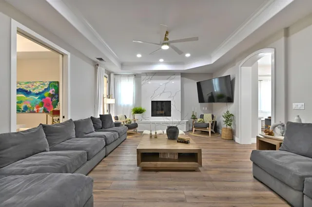 a kitchen with stainless steel appliances granite countertop white cabinets and a stove