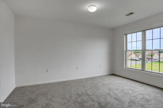 a bathroom with a sink a mirror and a toilet