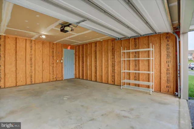 a view of empty room with chair