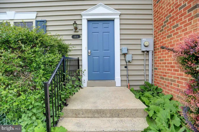 a view of house with backyard and garden