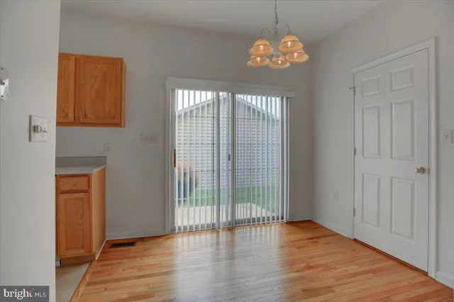 a view of entryway with wooden floor