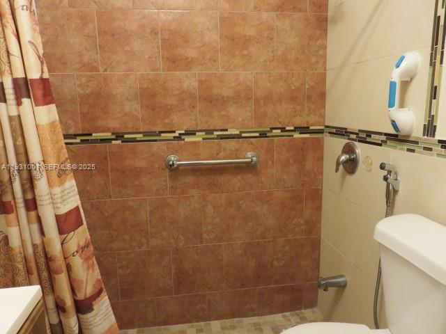 2820 Southwest 16th Terrace, Unit EFF Miami, FL 33145 - Photo 4 of 8 a bathroom with a shower and a toilet