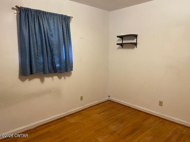 115 Barker Road Atwood, TN 38220 - Photo 14 of 16 a view of a room with wooden floor and a wall