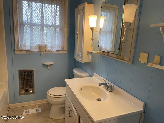 115 Barker Road Atwood, TN 38220 - Photo 16 of 16 a bathroom with a sink a toilet and a mirror
