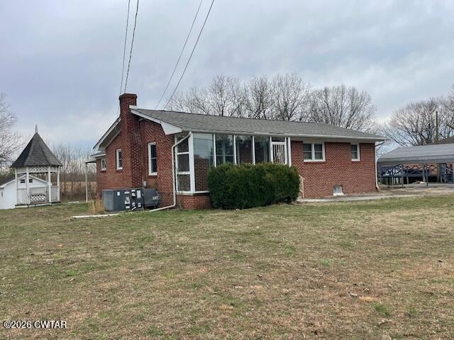 115 Barker Road Atwood, TN 38220 - Photo 3 of 16 a view of a yard in front of a house with large trees