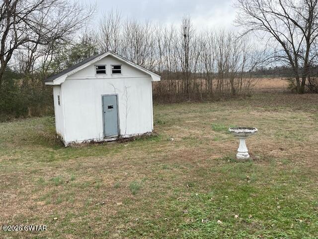 115 Barker Road Atwood, TN 38220 - Photo 7 of 16 a white house that has a tree in front of it