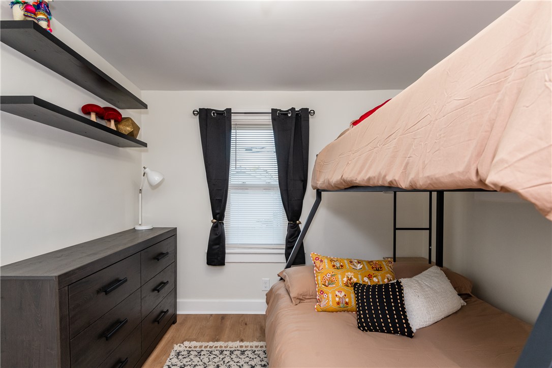 1915 Patterson Road Dayton, OH 45420 - Photo 34 of 48 This cozy bedroom features durable wood flooring and ample natural light, creating a comfortable living space.