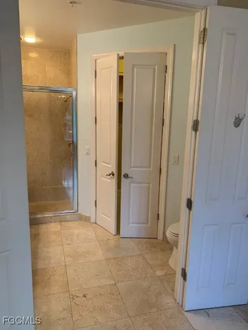 a bathroom with a shower and a sink