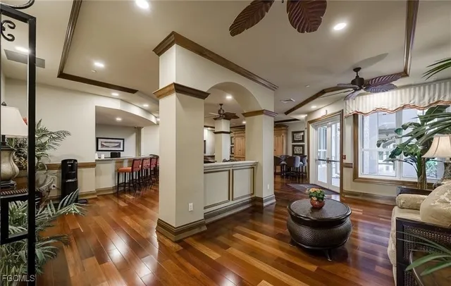 a living room with furniture and a kitchen