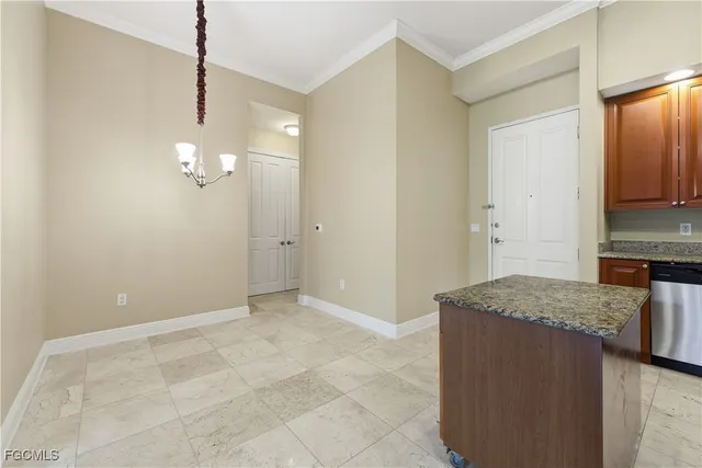 an empty room with windows and entrance