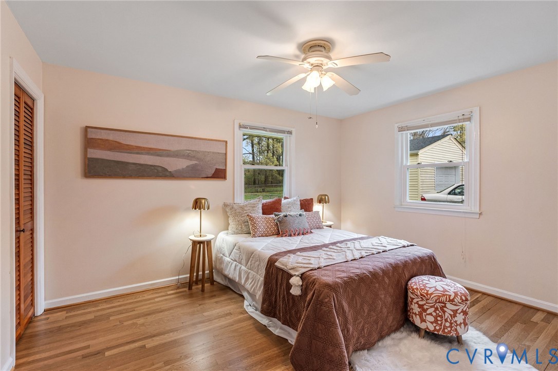 5904 Sutherland Drive Sutherland, VA 23885 - Photo 16 of 20 a bedroom with a bed and a chandelier