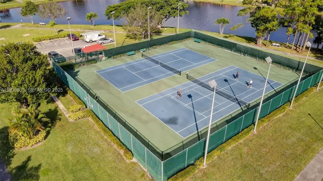 a view of swimming pool with a yard and seating area