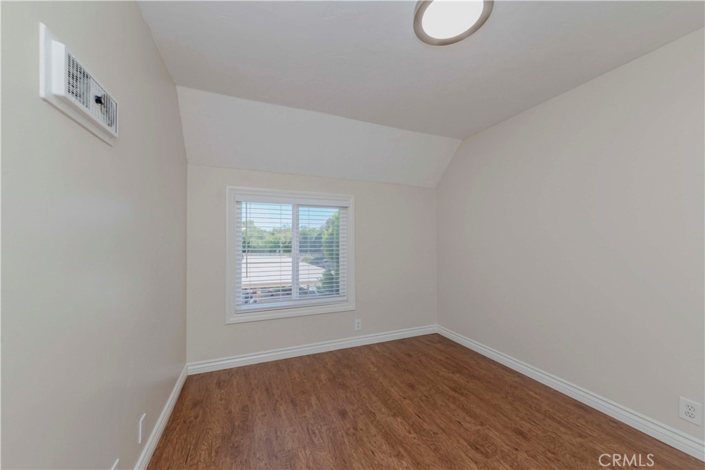 49 Meadowgrass Irvine, CA 92604 - Photo 12 of 25 an empty room with wooden floor and windows