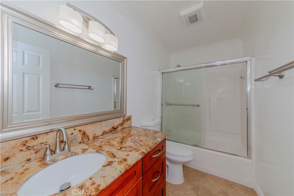 49 Meadowgrass Irvine, CA 92604 - Photo 13 of 25 a bathroom with a granite countertop sink toilet and shower