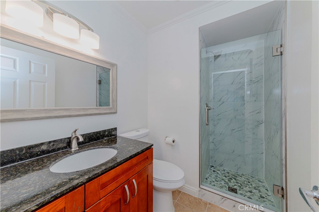 49 Meadowgrass Irvine, CA 92604 - Photo 14 of 25 a bathroom with a granite countertop sink toilet and shower