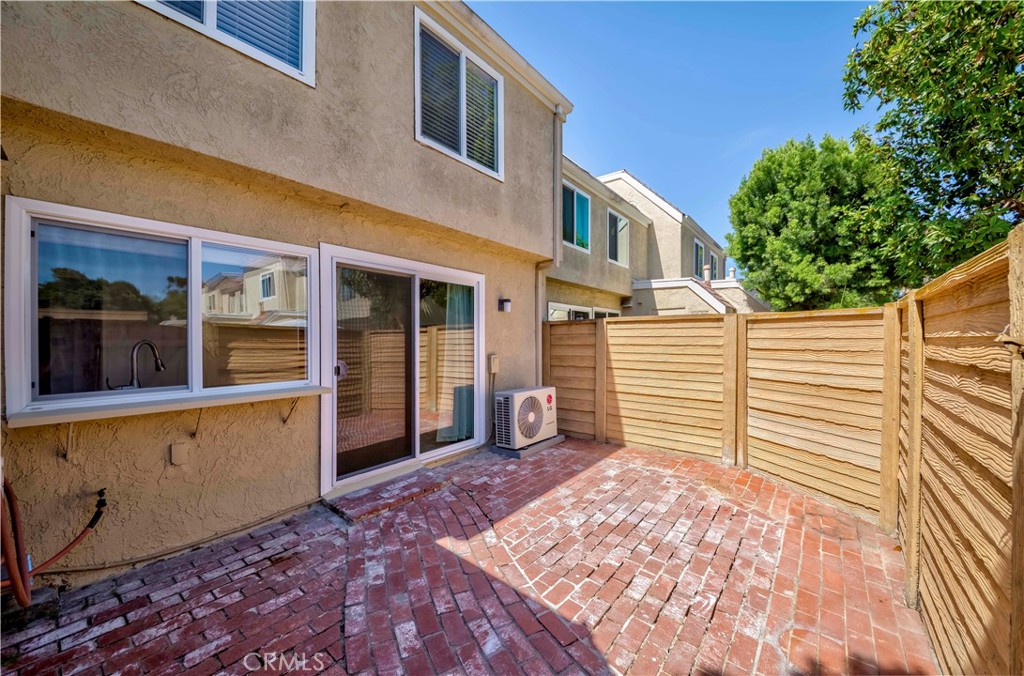 49 Meadowgrass Irvine, CA 92604 - Photo 15 of 25 a view of a house with a barbeque and wooden stairs