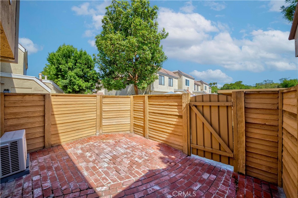 49 Meadowgrass Irvine, CA 92604 - Photo 16 of 25 a view of a pathway with a house in the background