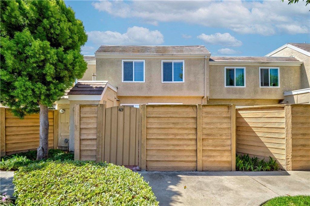 49 Meadowgrass Irvine, CA 92604 - Photo 17 of 25 a view of a house with a backyard