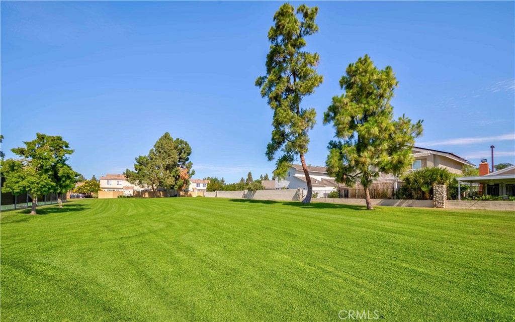 49 Meadowgrass Irvine, CA 92604 - Photo 25 of 25 a view of a park with a building in the background