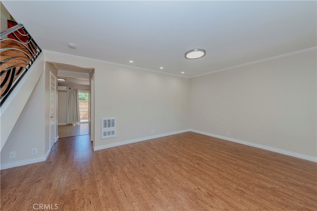 49 Meadowgrass Irvine, CA 92604 - Photo 3 of 25 wooden floor in an empty room with a window