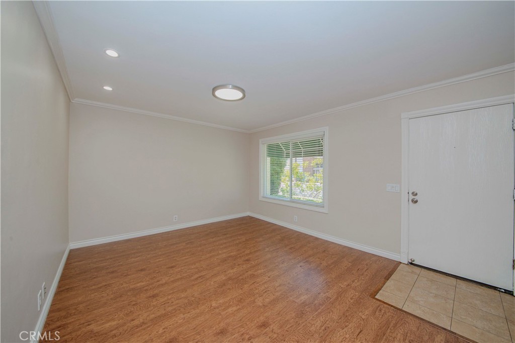 49 Meadowgrass Irvine, CA 92604 - Photo 5 of 25 wooden floor in an empty room with a window