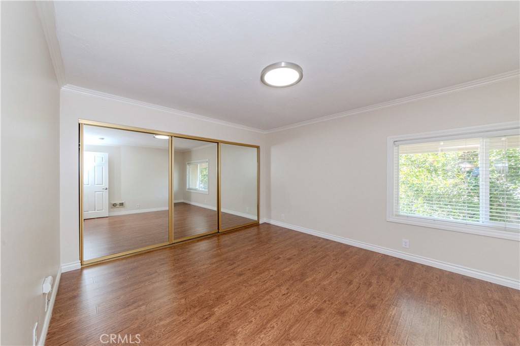 49 Meadowgrass Irvine, CA 92604 - Photo 9 of 25 an empty room with wooden floor and windows