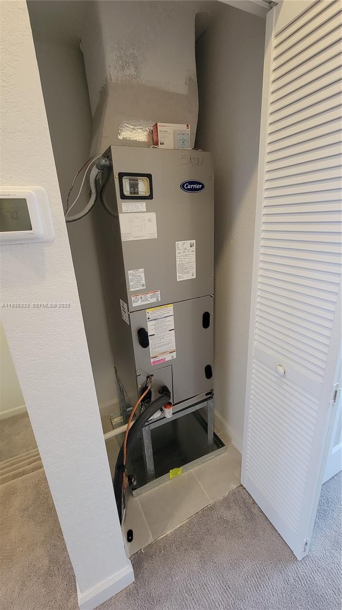 26430 Southwest 148th Court, Unit 26430 Homestead, FL 33032 - Photo 14 of 21 a view of a storage & utility room