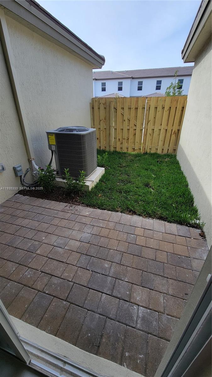 26430 Southwest 148th Court, Unit 26430 Homestead, FL 33032 - Photo 18 of 21 a view of a back yard of the house